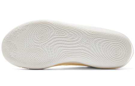 Milky white basketball shoe outsole with patterned tread