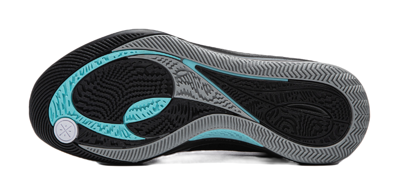 Black basketball shoe outsole with teal traction zones and textured tread pattern