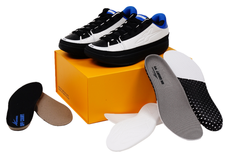 Unisex basketball shoes with included gray-and-black insoles/liners shown beside them.