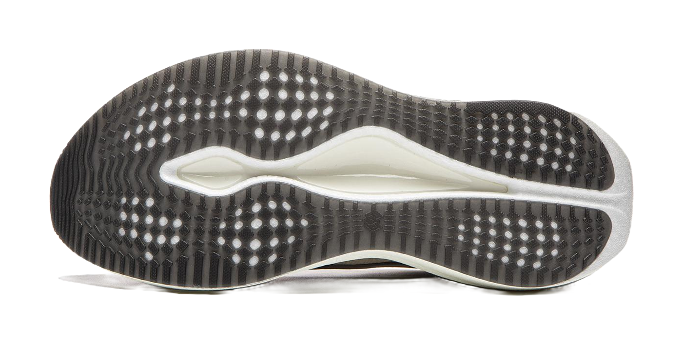 Champagne white running shoe outsole with grippy dot pattern and blue-tinted edge