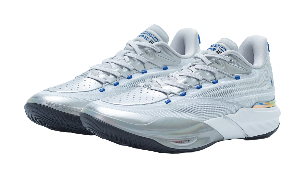 Silver basketball shoe pair, side view with blue lace accents and textured midsole