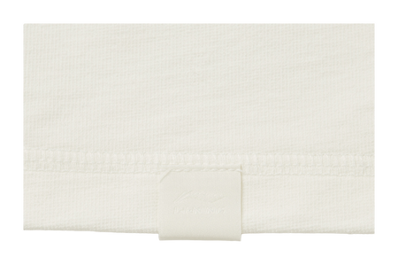 Ivory long-sleeve T-shirt hem with inner size label