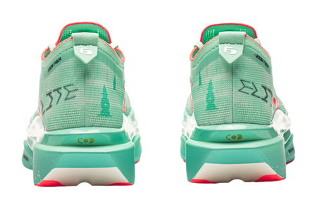 Back view of mint green low-top running shoes with red trim and heel tabs