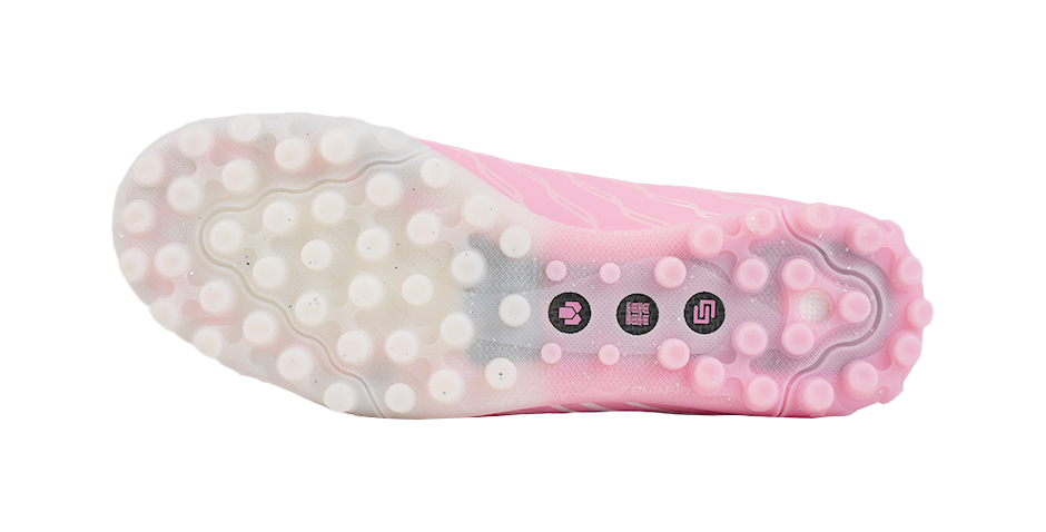 Turf soccer shoe outsole, pinkish dotted studs and cushioned traction base