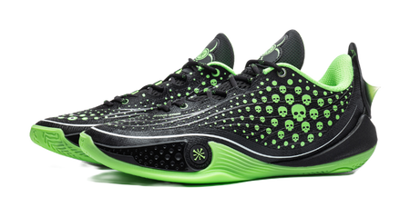 Black low basketball sneaker with neon green laces, skull-dot upper, and green midsole