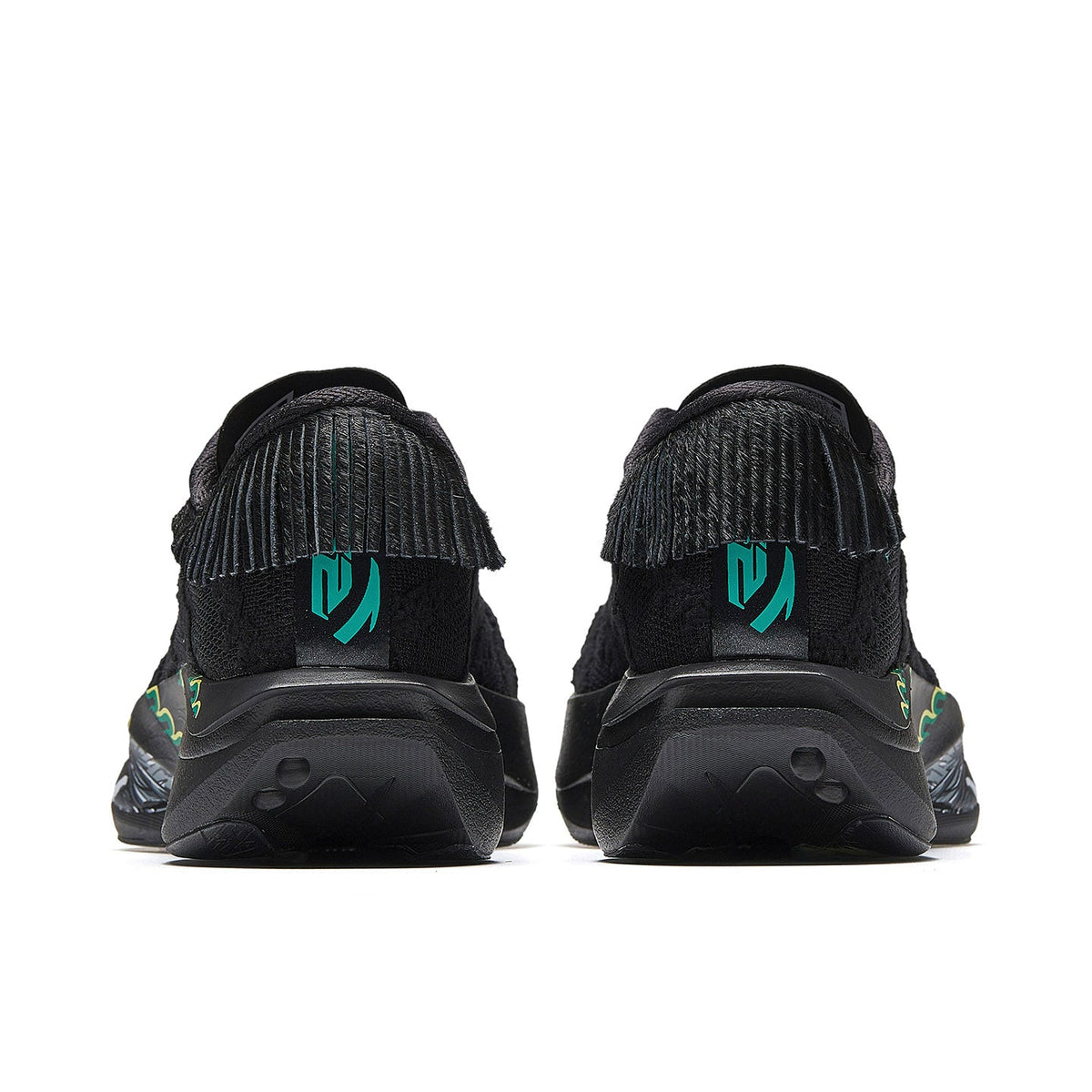 Women’s black running shoes, rear view with green logo panels and cushioned heel.