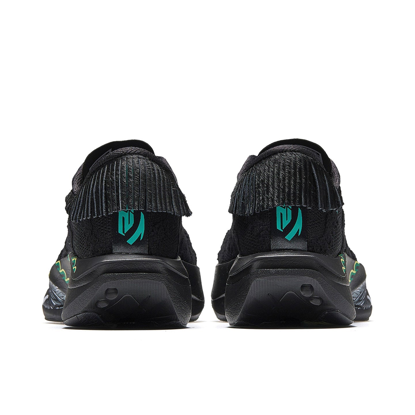 Women’s black running shoes, rear view with green logo panels and cushioned heel.