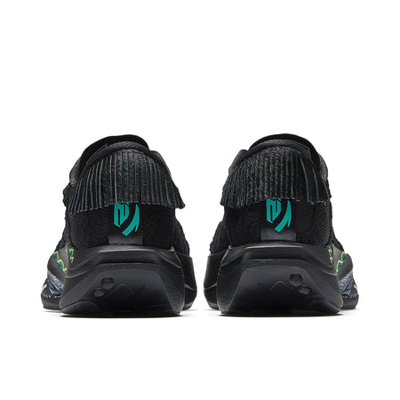 Women’s black running shoes, rear view with green logo panels and cushioned heel.