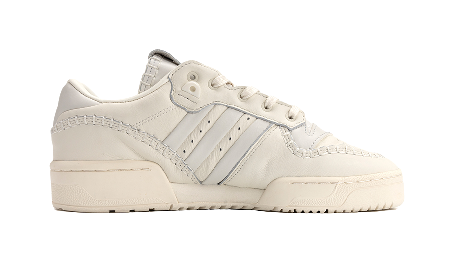 Ecru low-top Adidas Campus sneakers, side view with padded collar and stripes