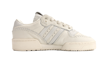 Ecru low-top Adidas Campus sneakers, side view with padded collar and stripes