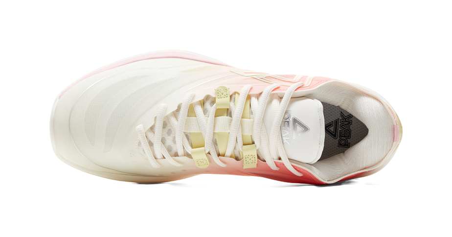 Lightweight basketball shoe top view with white laces, pink upper and green accents