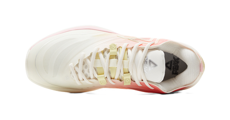 Lightweight basketball shoe top view with white laces, pink upper and green accents