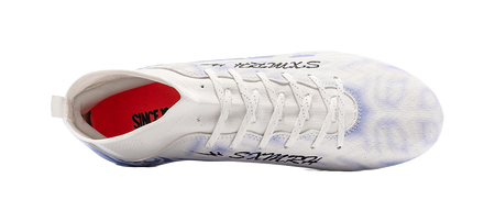 White soccer shoe with red lining at heel and lace-up closure