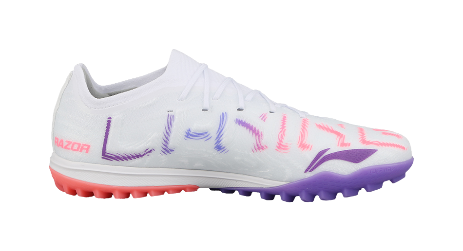 White soccer shoe side view with purple and pink accents and red outsole studs