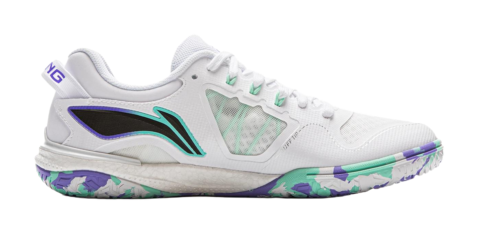 White table tennis shoe side view with teal logo and purple trim