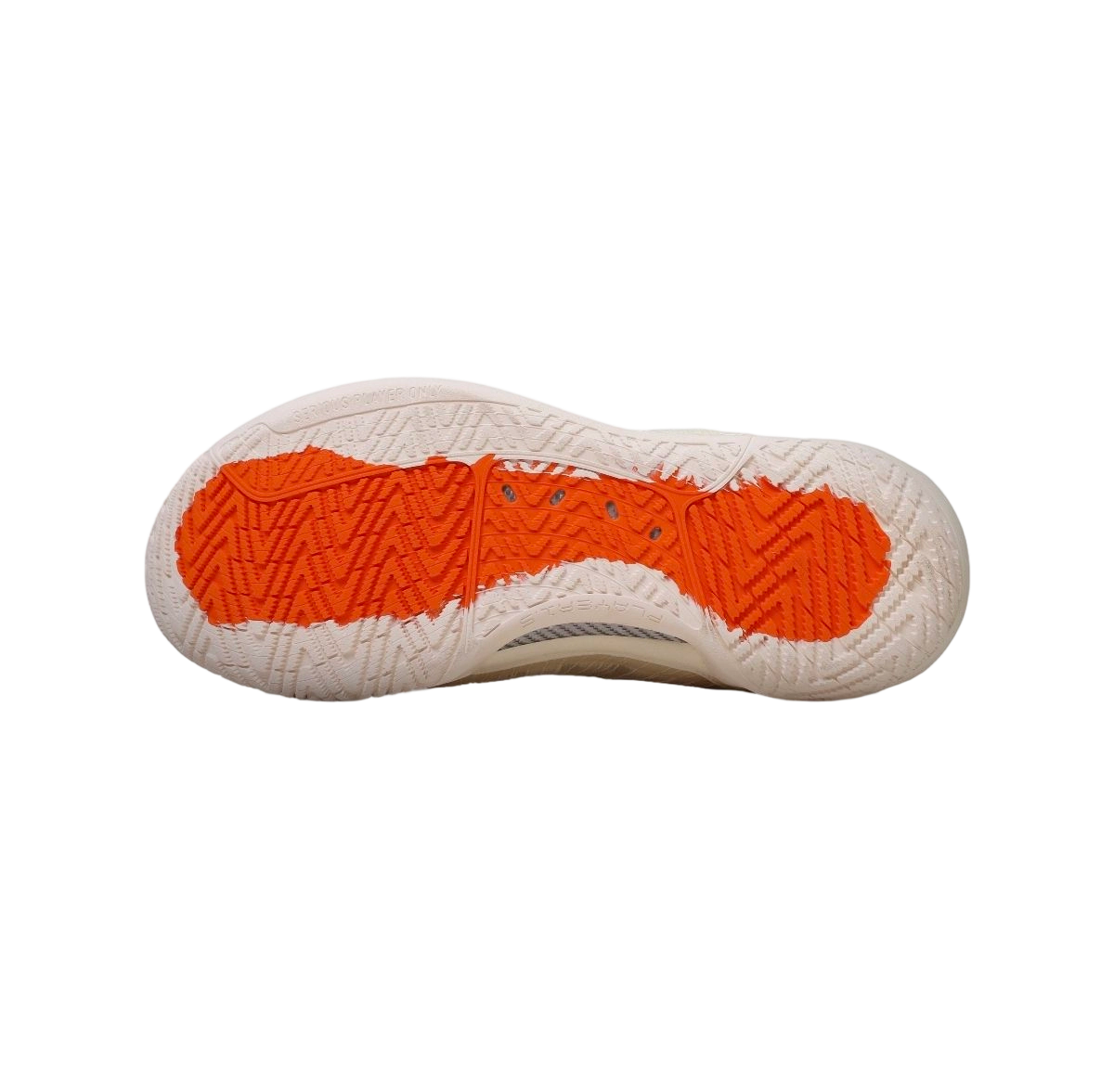 Mid basketball shoe outsole with deep tread and orange rubber traction sections