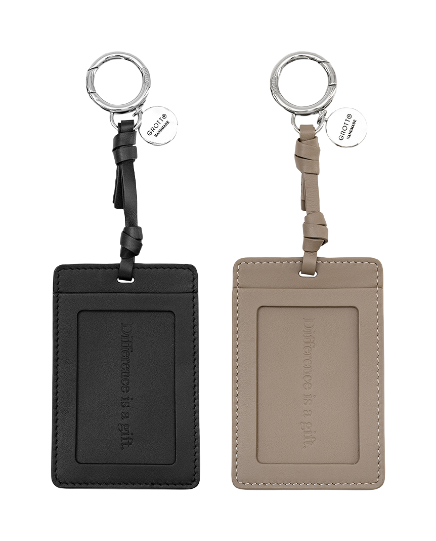 Leather key fob set with metal ring and stitched tag card, black and tan