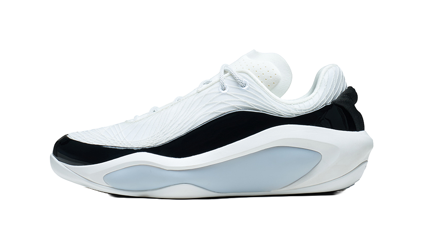 White and black basketball shoe with light-blue sole, side view