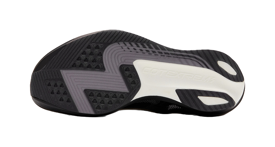 Black rubber outsole with deep tread pattern and white traction accents