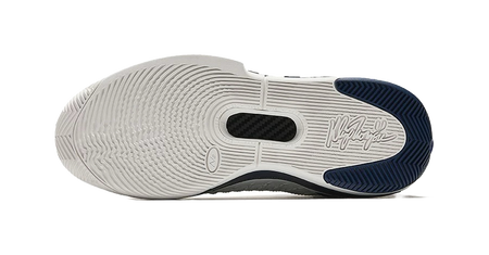 Unisex low basketball shoe outsole tread, white midsole with navy heel trim
