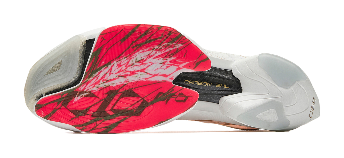 Marathon racing shoe sole view: white upper with red insert and carbon-style heel plate