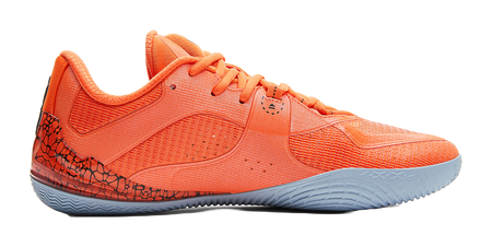 Orange basketball shoe, side view, textured upper and blue-gray rubber sole