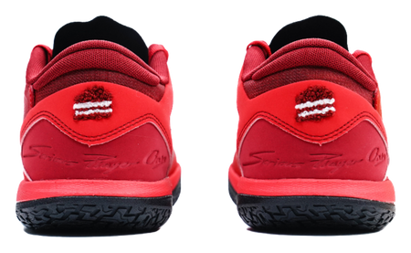 Red low-top basketball shoes, heel view with logo detail and black outsole