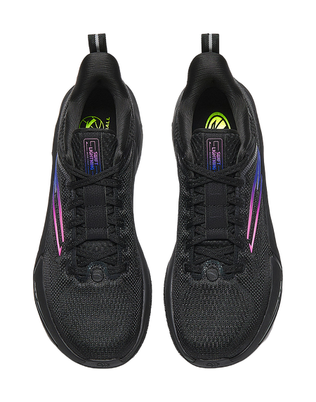 Black basketball shoes showing tongues and lace area, neon-green branding on heel tabs