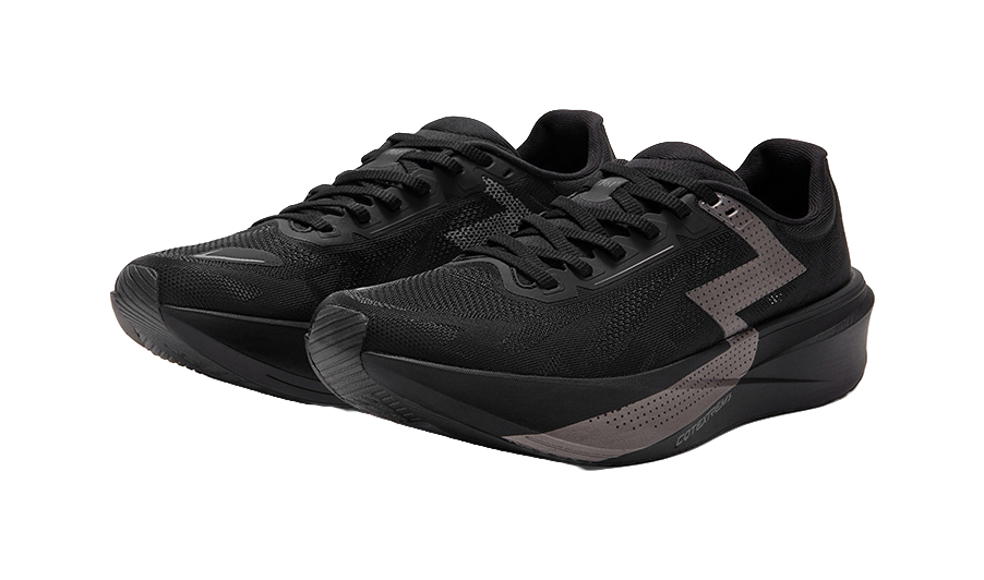 Two black low running shoes with textured uppers and gray accent stripe