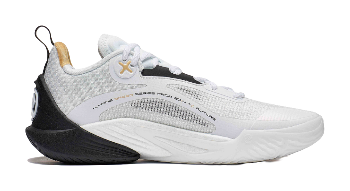 White and black basketball shoe with gray detailing, lace-up knit upper and black sole