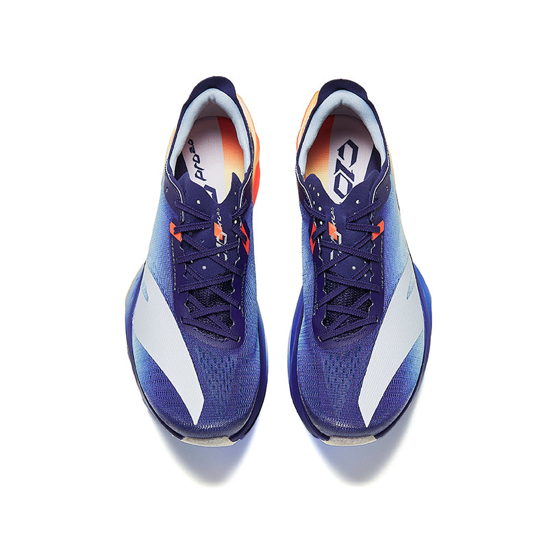 Pair of unisex running shoes with blue gradient knit upper, orange lace details