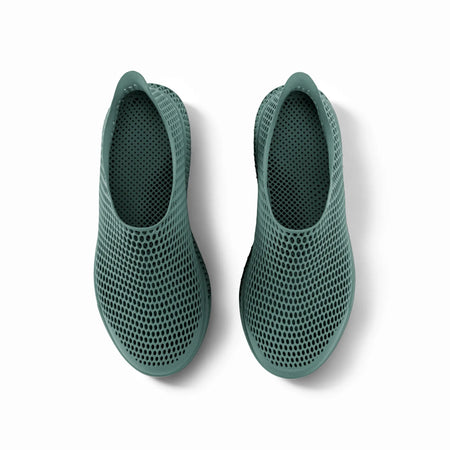 Green 3D-printed slip-on sneakers back view with perforated heel and mesh upper