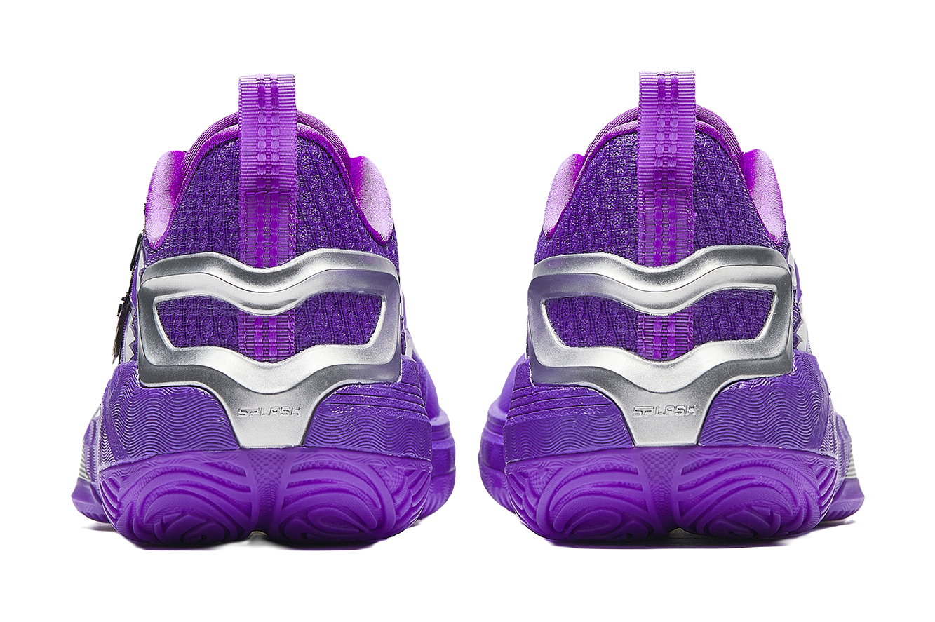Purple basketball shoes with silver heel counter and textured rubber outsole tread.