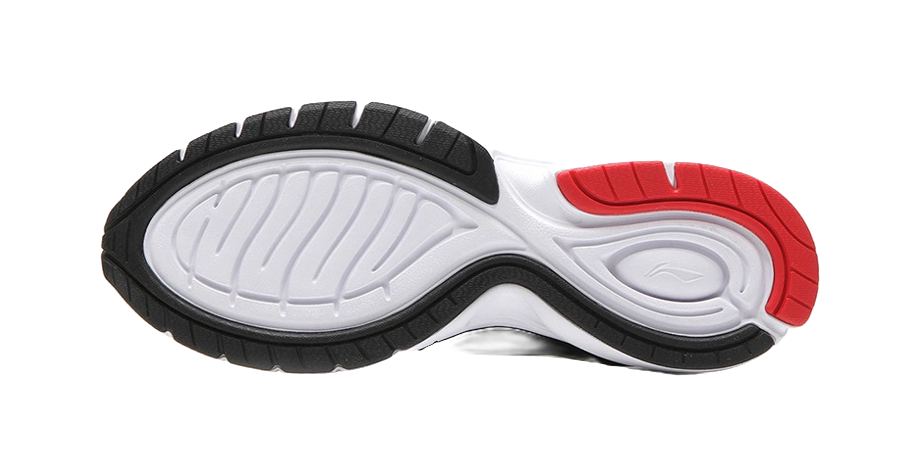 Black and white running shoe outsole with red heel section, treaded rubber sole