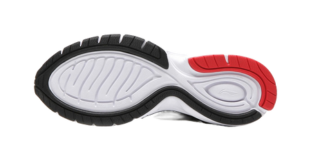 Black and white running shoe outsole with red heel section, treaded rubber sole