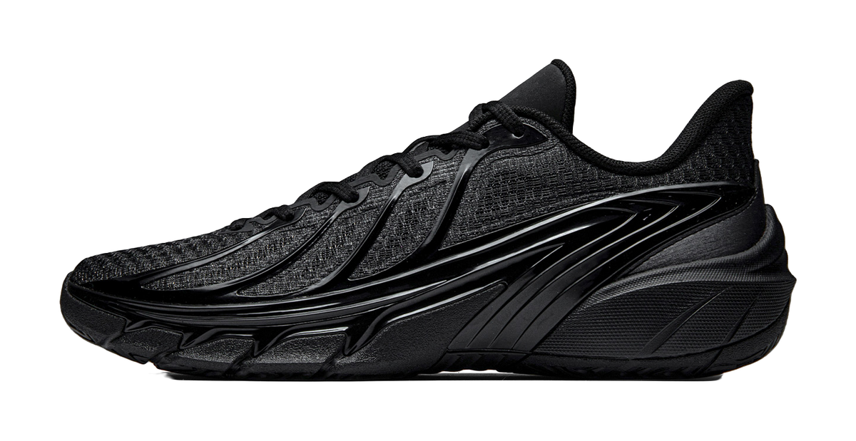 Black low-top basketball shoes with lace-up closure and sculpted TPU sole