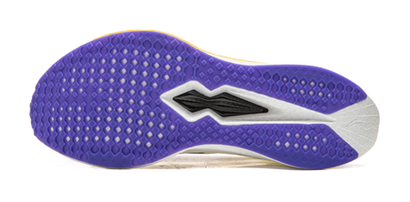Purple outsole of champagne white running shoe with textured traction pattern