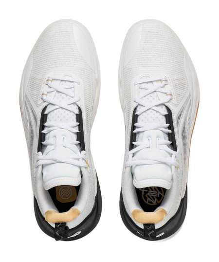 Pair of white basketball shoes with white laces and gray side panels