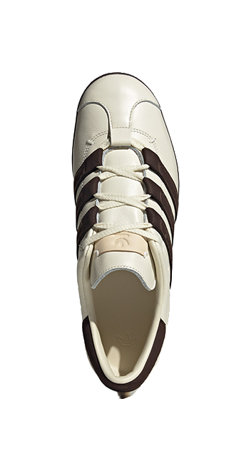 Unisex low-top skate shoes, cream toe view with dark brown side stripes