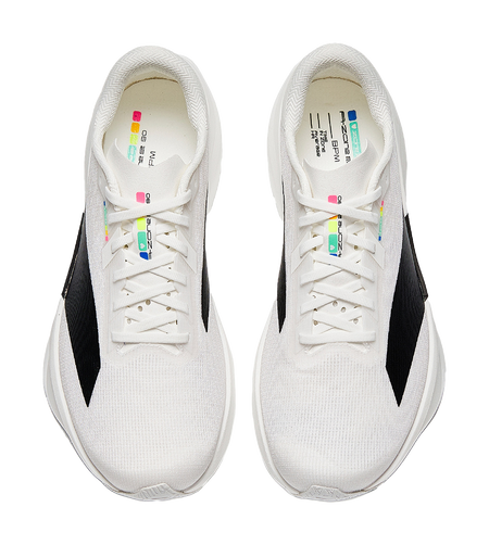 White lace-up running shoes with multicolor tongue text and black side stripe logos