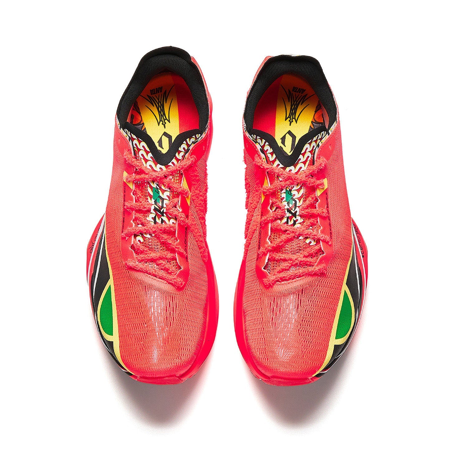 Neon red running shoes with patterned tongue lining and black interior collar