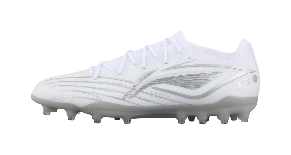 White silvery soccer cleat with molded studs, side view.