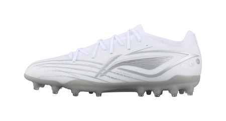 White silvery soccer cleat with molded studs, side view.