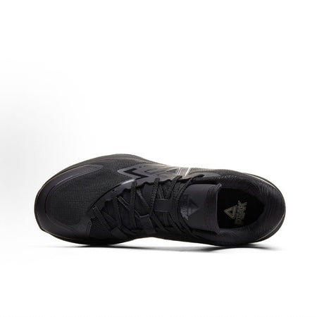 Black basketball shoe top view, laces and padded collar with brand mark