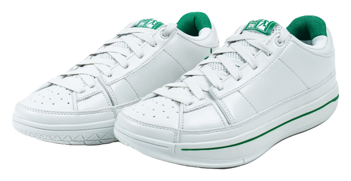 Pair of white low-top sneakers with green accents, lace-up front, and padded collar