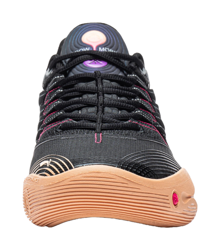 Low basketball shoe close-up: black upper with pink laces and gum toe bumper.