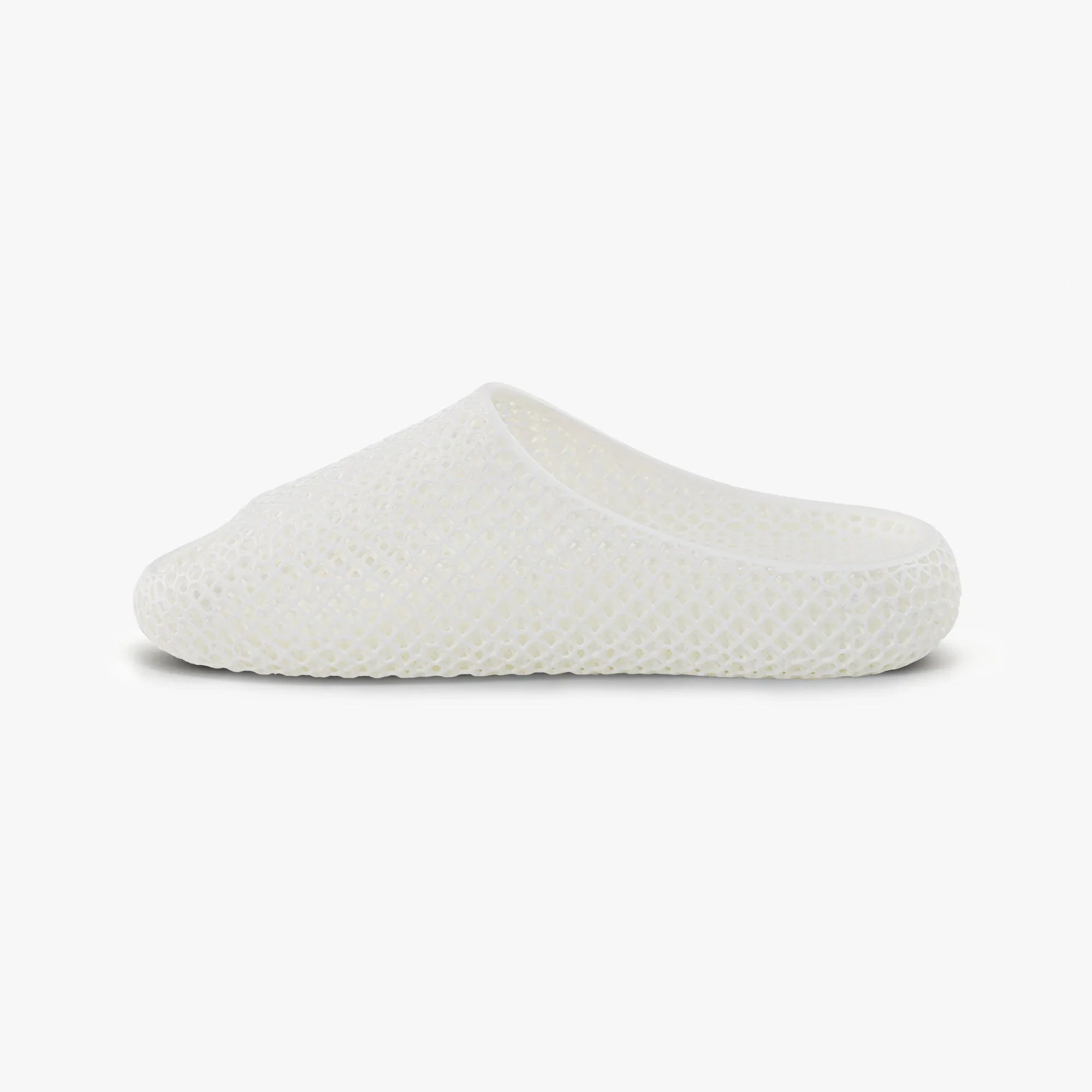 White 3D-printed slip-on slippers with textured honeycomb upper and rounded side profile