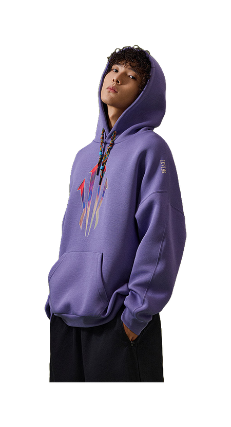 Purple unisex pullover hoodie sweatshirt on model, side view with front graphic and hood