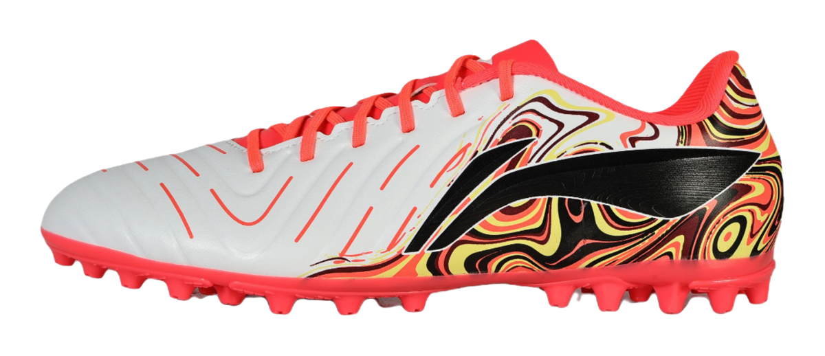 White and red unisex soccer shoe with neon laces, swirl graphic, and red stud sole