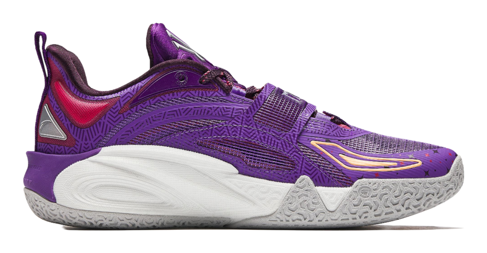 Purple basketball shoe with red heel accents, strap details, and white/gray outsole.